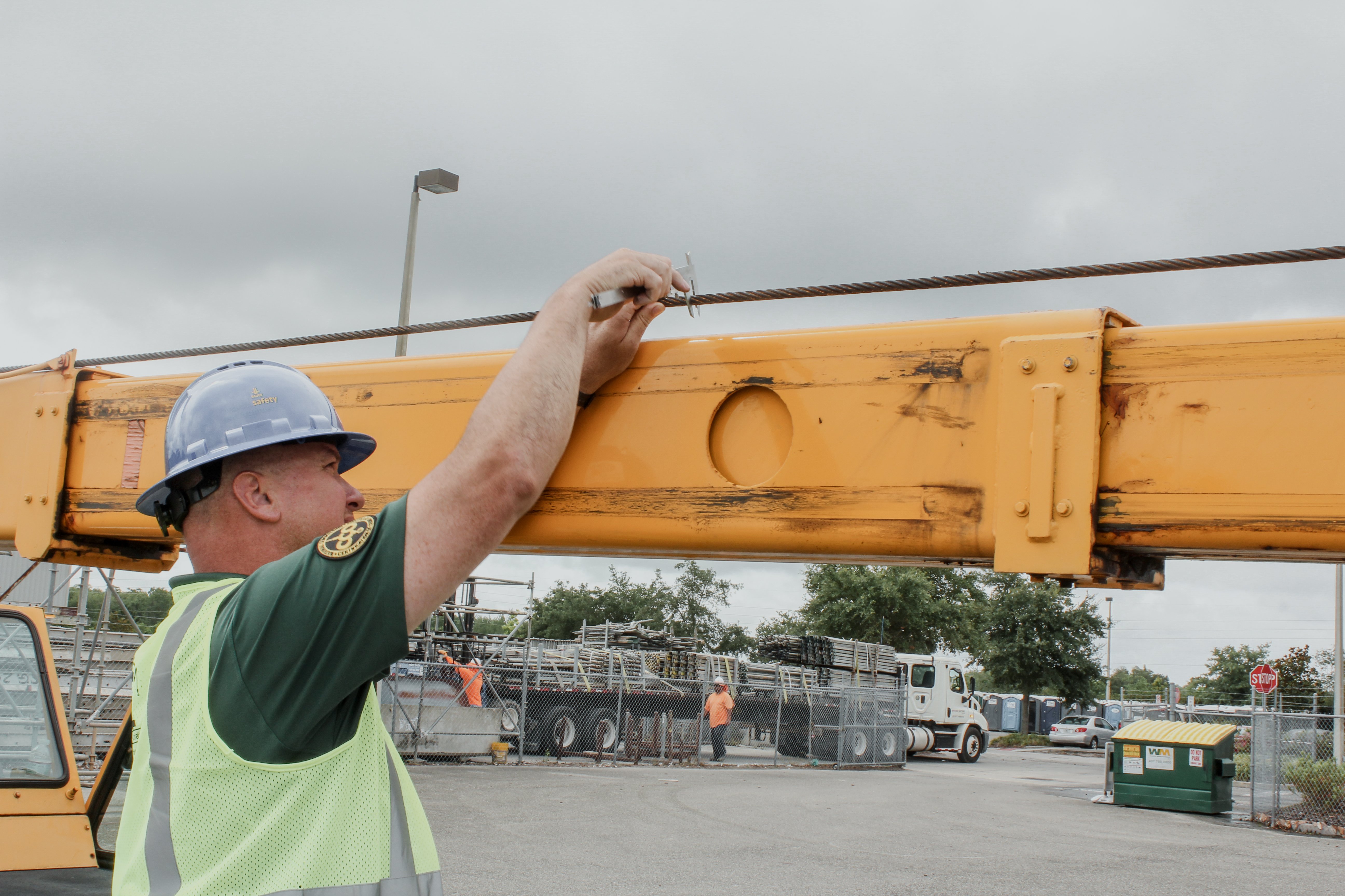 Photo of an inspector inspecting a crane